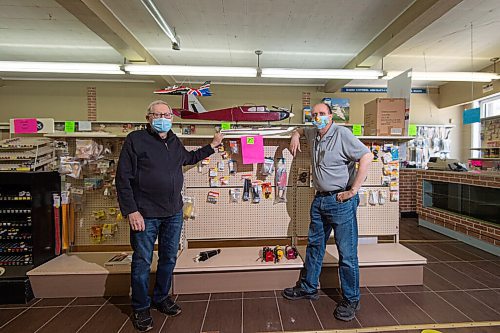 MIKE SUDOMA / WINNIPEG FREE PRESS
Cellar Dweller Owner, Gerry Fingler (left) and long time sales staff, Jim Holland (right) stand amongst a shelf of stock for one of the last times before Cellar Dwellers official closing day Saturday
May 28, 2021