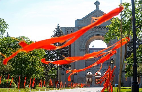MIKE DEAL / WINNIPEG FREE PRESS
215 orange ribbons line the path to the old St. Boniface Cathedral, a memorial to the 215 children recently found buried in an unmarked gravesite at the former Kamloops Indian Residential School in B.C.
***See Ryan Thorpe story for 49.8 feature
210601 - Tuesday, June 01, 2021.