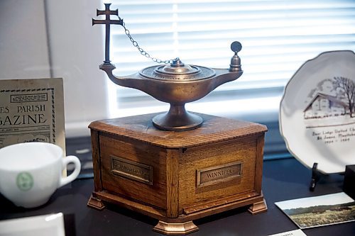 MIKE DEAL / WINNIPEG FREE PRESS
A behind the scenes look at the St. James Historical Museum (3180 Portage Ave) conducted by executive director and managing curator, Bonita Hunter-Eastwood.
A Toc H oil lamp lit by Prince of Wales. 
Toc H was a non-denominational Christian movement that began in Europe in WWI and spread worldwide in the 1920s and 30s. 
The Lamp of Maintenance was a symbolic representation of the vitality of the Toc H movement and the light it brought into peoples lives, but it was also utilized in the rituals of the organization. Each Toc H meeting began with the lighting of the lamp and a short prayer for those killed in the Great War.
210601 - Tuesday, June 01, 2021.