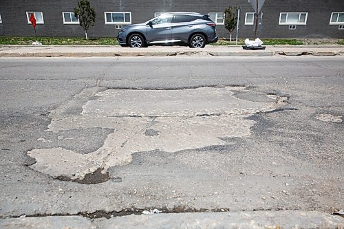 MIKE DEAL / WINNIPEG FREE PRESS
Cars drive through dips and crumbling road on a stretch of Taylor Ave near the Stafford Street intersection.
The votes have been tabulated and the CAA Manitoba Worst Road for 2021 is Taylor Avenue in Winnipeg, making its debut on the Top 10 list due to potholes and crumbling infrastructure. 
Nearly 3000 votes cast in the 2021 CAA Manitoba Worst Roads campaign.
According to Heather Mack, government and community relations manager at CAA Manitoba, Cyclists and pedestrians accounted for 10% of the votes and pointed to potholes, poor cycling infrastructure, and sidewalk obstructions as top concerns.
210602 - Wednesday, June 02, 2021.