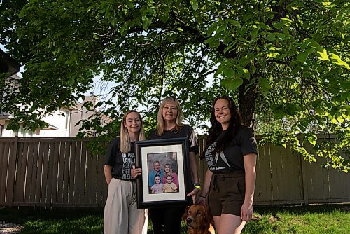 ALEX LUPUL / WINNIPEG FREE PRESS  

Jo-Anne McNeil holds a family photo with her daughters Sarah and Taylor at their home in Winnipeg Wednesday, June 2, 2021. Pat McNeil, husband to Jo-Anne and father of Sarah and Taylor, is now weeks away from dying of brain cancer. He is only allowed to see his wife and not his daughters while in palliative care.

Reporter: Kevin Rollason