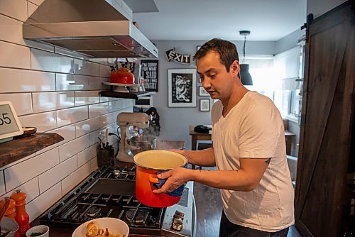 ALEX LUPUL / WINNIPEG FREE PRESS  

Kyle Lew, one half of the husband-and-wife team behind the cafe Lark, helps to prepare a meal in his home in Winnipeg Wednesday, June 2, 2021. The homemade family-friendly ricotta meatball dish Kyle and Kristen prepared is a favourite of their children.

Reporter: Eva Wasney