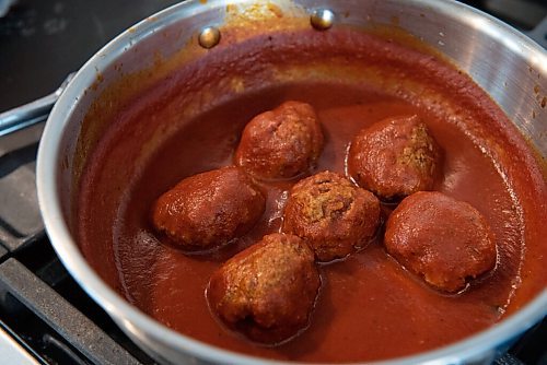 ALEX LUPUL / WINNIPEG FREE PRESS  

Meatballs prepared by Kyle Lew and Kristen Chemerika-Lew are photographed in Winnipeg Wednesday, June 2, 2021. The homemade family-friendly ricotta meatball dish Kyle and Kristen prepared is a favourite of their children.

Reporter: Eva Wasney