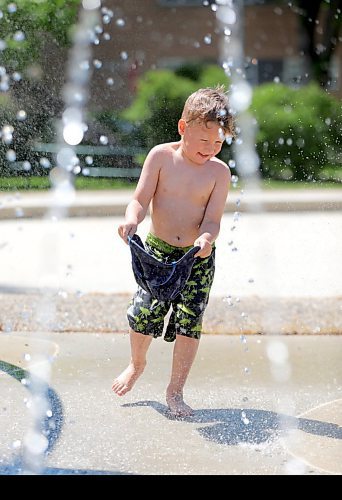 RUTH BONNEVILLE / WINNIPEG FREE PRESS


Local - Splash Pads open in City


Micah Depape (4yrs), fills his sun hat with water while playing at the Vimy Ridge Memorial Park Splash Pad while his granddad, Don  McBain, watching him  on Thursday. 




June 03, 2021