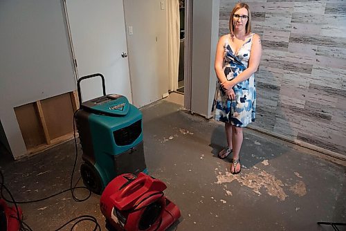 ALEX LUPUL / WINNIPEG FREE PRESS  
 
Kaitlin Bialek poses for a portrait in the living room of her Winnipeg home, which suffered damage by cement rising out of sewer lines and spreading across the floor Thursday, June 3, 2021. Cause is believed to have come from an error in a sewage upgrade by a city contractor.

Reporter: Joyanne Pursaga