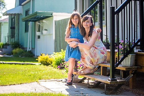 MIKAELA MACKENZIE / WINNIPEG FREE PRESS

Renée Cable and her daughter, Madeleine Linner (eight) pose for a portrait on their front steps in Winnipeg on Thursday, June 3, 2021. Cable said her daughter teared up when she heard she would not be returning to school full-time this year. For Maggie story.
Winnipeg Free Press 2021.