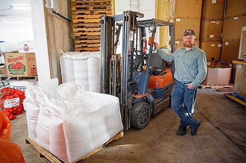 MIKE DEAL / WINNIPEG FREE PRESS
Benjamin Unrau, an organic farmer near McGregor who grows Red Fife wheat - the variety that was first used on the Prairies when settlers began farming in Manitoba in the late 1800s.
Benjamin uses a forklift to get a large container of Red Fife wheat from storage.
See Alan Small Farm-to-table feature
210604 - Friday, June 04, 2021.