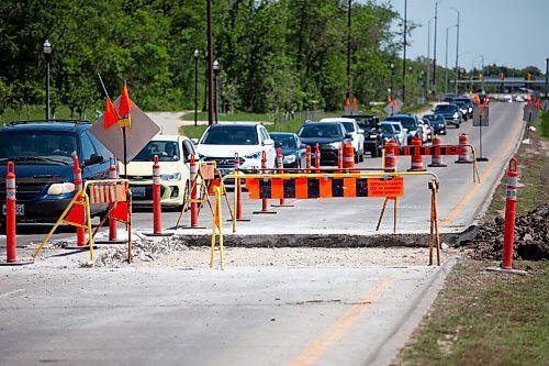 Daniel Crump / Winnipeg Free Press. The recent hot weather has caused a section of road on the Chief Peguis Trail between Henderson highway and Main st. to buckle. The left west-bound lane will be will be closed for a number of days until repairs are completed. June 5, 2021.