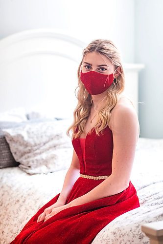 MIKAELA MACKENZIE / WINNIPEG FREE PRESS

Alexa Craig, who is graduating this year, poses for a portrait in her grad dress in her room in Winnipeg on Monday, June 7, 2021. She's one of thousands of Winnipeg grads who said yes to the dress, only for public health to say no to gatherings. For Jen Zoratti story.
Winnipeg Free Press 2021.