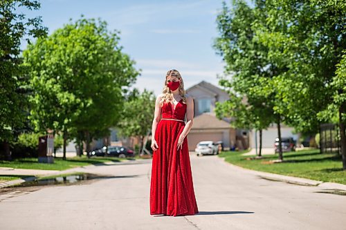 MIKAELA MACKENZIE / WINNIPEG FREE PRESS

Alexa Craig, who is graduating this year, poses for a portrait in her grad dress on her street in Winnipeg on Monday, June 7, 2021. She's one of thousands of Winnipeg grads who said yes to the dress, only for public health to say no to gatherings. For Jen Zoratti story.
Winnipeg Free Press 2021.