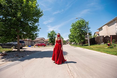 MIKAELA MACKENZIE / WINNIPEG FREE PRESS

Alexa Craig, who is graduating this year, poses for a portrait in her grad dress on her street in Winnipeg on Monday, June 7, 2021. She's one of thousands of Winnipeg grads who said yes to the dress, only for public health to say no to gatherings. For Jen Zoratti story.
Winnipeg Free Press 2021.