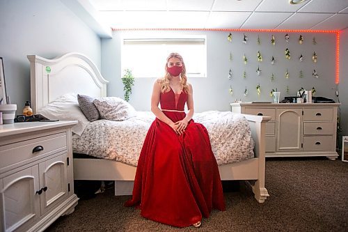 MIKAELA MACKENZIE / WINNIPEG FREE PRESS

Alexa Craig, who is graduating this year, poses for a portrait in her grad dress in her room in Winnipeg on Monday, June 7, 2021. She's one of thousands of Winnipeg grads who said yes to the dress, only for public health to say no to gatherings. For Jen Zoratti story.
Winnipeg Free Press 2021.