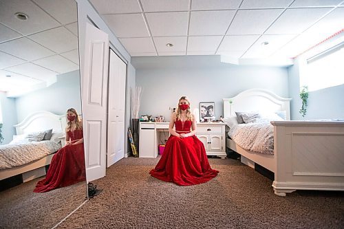 MIKAELA MACKENZIE / WINNIPEG FREE PRESS

Alexa Craig, who is graduating this year, poses for a portrait in her grad dress in her room in Winnipeg on Monday, June 7, 2021. She's one of thousands of Winnipeg grads who said yes to the dress, only for public health to say no to gatherings. For Jen Zoratti story.
Winnipeg Free Press 2021.