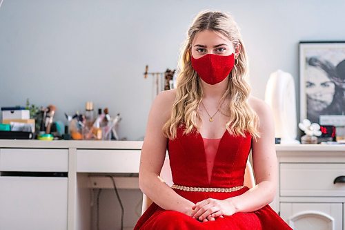 MIKAELA MACKENZIE / WINNIPEG FREE PRESS

Alexa Craig, who is graduating this year, poses for a portrait in her grad dress in her room in Winnipeg on Monday, June 7, 2021. She's one of thousands of Winnipeg grads who said yes to the dress, only for public health to say no to gatherings. For Jen Zoratti story.
Winnipeg Free Press 2021.