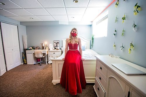 MIKAELA MACKENZIE / WINNIPEG FREE PRESS

Alexa Craig, who is graduating this year, poses for a portrait in her grad dress in her room in Winnipeg on Monday, June 7, 2021. She's one of thousands of Winnipeg grads who said yes to the dress, only for public health to say no to gatherings. For Jen Zoratti story.
Winnipeg Free Press 2021.