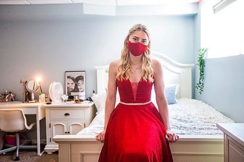 MIKAELA MACKENZIE / WINNIPEG FREE PRESS

Alexa Craig, who is graduating this year, poses for a portrait in her grad dress in her room in Winnipeg on Monday, June 7, 2021. She's one of thousands of Winnipeg grads who said yes to the dress, only for public health to say no to gatherings. For Jen Zoratti story.
Winnipeg Free Press 2021.