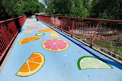 JOHN WOODS / WINNIPEG FREE PRESS
A person crosses the Niakwa Road Bridge, which CoolStreets Winnipeg has painted with citrus fruit, Monday, June 7, 2021. 

Reporter: Standup