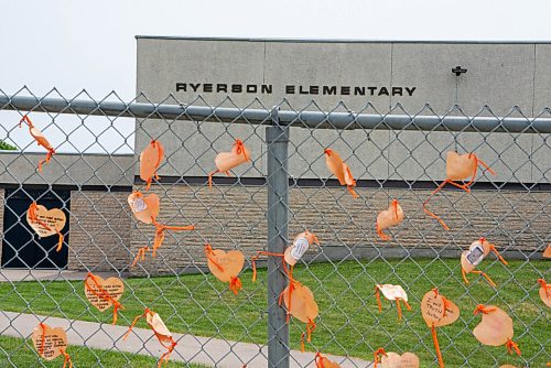 ALEX LUPUL / WINNIPEG FREE PRESS  

Orange hearts tied to the fence outside of  Ryerson School are photographed in Winnipeg on Tuesday, June 8, 2021. The hearts contain messages, written by staff and students, explaining actions they will take to assist the indigenous community. The elementary school is named after Egerton Ryerson, who is considered a chief architect of Canada's residential school system.