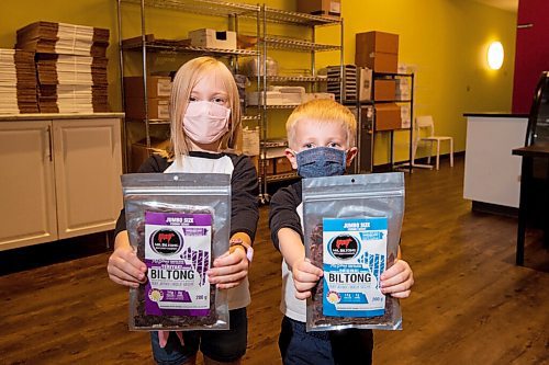 MIKE SUDOMA / WINNIPEG FREE PRESS
Emily and Greyson Silcox hold up packages of Mr Biltong Beef Jerky, a company their dad Jeremy started after spending 4 years in Johannesburg for work
June 9, 2021