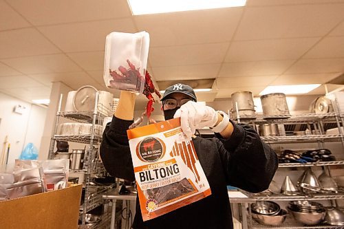 MIKE SUDOMA / WINNIPEG FREE PRESS
Natasha Bauml pours some freshly made beef biltong into a package Tuesday evening
June 9, 2021