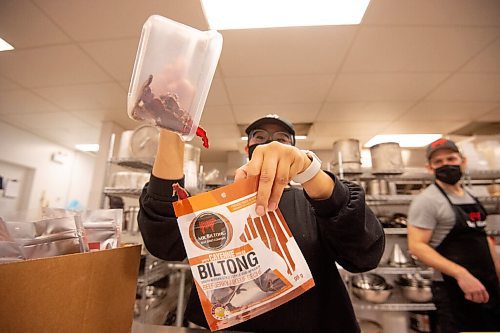 MIKE SUDOMA / WINNIPEG FREE PRESS
Natasha Bauml pours some freshly made beef biltong into a package Tuesday evening
June 9, 2021