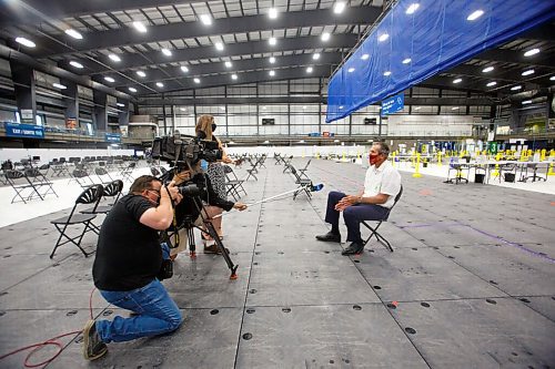 MIKE DEAL / WINNIPEG FREE PRESS
Premier Brian Pallister talks to the media after receiving his second COVID-19 vaccine dose from Dr. Joss Reimer, medical officer of health, Manitoba Health and Seniors Care, and medical lead, Manitoba Vaccine Implementation Task Force at the Winnipeg super site on Leila Avenue Thursday morning.
210610 - Thursday, June 10, 2021.