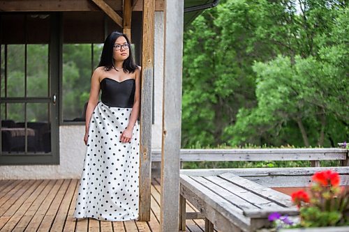 MIKAELA MACKENZIE / WINNIPEG FREE PRESS

SJR student Lauren McIlroy poses for a portrait (in one of the two dresses that she was excited to wear to grad events that have been cancelled) at her home in La Salle on Thursday, June 10, 2021. For Jen story.
Winnipeg Free Press 2021.