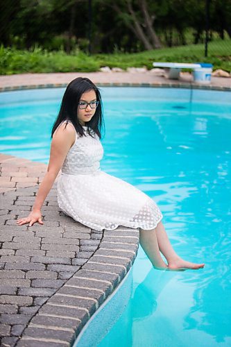 MIKAELA MACKENZIE / WINNIPEG FREE PRESS

SJR student Lauren McIlroy poses for a portrait (in one of the two dresses that she was excited to wear to grad events that have been cancelled) at her home in La Salle on Thursday, June 10, 2021. For Jen story.
Winnipeg Free Press 2021.