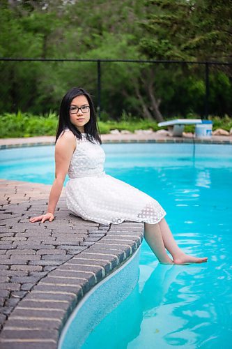 MIKAELA MACKENZIE / WINNIPEG FREE PRESS

SJR student Lauren McIlroy poses for a portrait (in one of the two dresses that she was excited to wear to grad events that have been cancelled) at her home in La Salle on Thursday, June 10, 2021. For Jen story.
Winnipeg Free Press 2021.