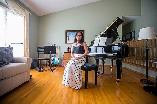 MIKAELA MACKENZIE / WINNIPEG FREE PRESS

SJR student Lauren McIlroy poses for a portrait (in one of the two dresses that she was excited to wear to grad events that have been cancelled) at her home in La Salle on Thursday, June 10, 2021. For Jen story.
Winnipeg Free Press 2021.