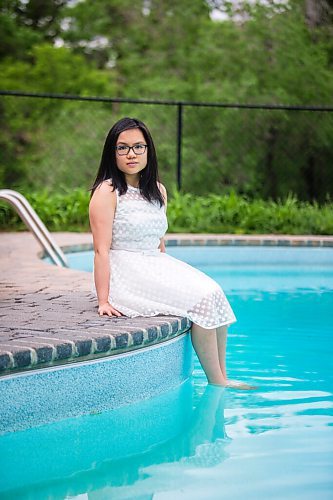 MIKAELA MACKENZIE / WINNIPEG FREE PRESS

SJR student Lauren McIlroy poses for a portrait (in one of the two dresses that she was excited to wear to grad events that have been cancelled) at her home in La Salle on Thursday, June 10, 2021. For Jen story.
Winnipeg Free Press 2021.