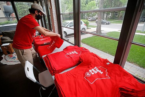 JOHN WOODS / WINNIPEG FREE PRESS
Aaron Beckman, a Winnipeg resource teacher and member of Protect EdMB, organizes and distributes red t-shirts in his sunroom Thursday, June 10, 2021. Beckman oversees the Protect EdMB Red For Ed t-shirt campaign which speaks out about the provincial governments Bill 64, which overhauls K-12 education, and also raises money for school breakfast and lunch programs.

Reporter: Macintosh