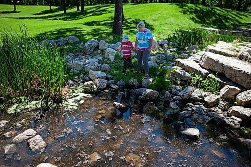 Daniel Crump / Winnipeg Free Press. Heather Jagger and her son Parker Davidson catch tadpoles at a creek in Kildonan Park. June 12, 2021.