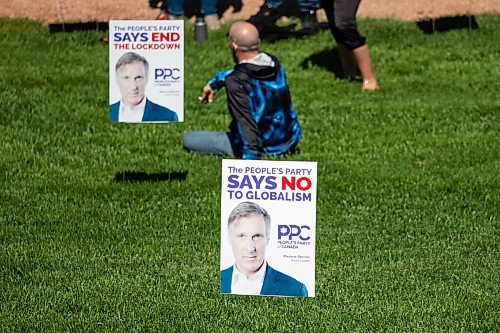 Daniel Crump / Winnipeg Free Press. Signs for Maxime Bernier are a prominent feature during an anti-restrictions rally at the Forks on Saturday afternoon. June 12, 2021.