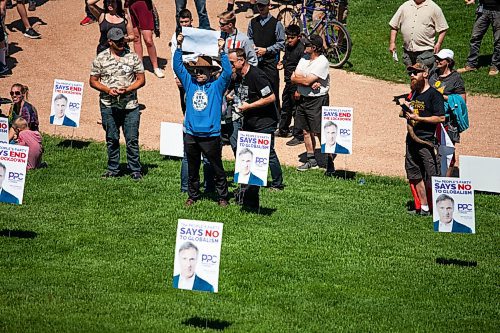 Daniel Crump / Winnipeg Free Press. Signs for Maxime Bernier are a prominent feature during an anti-restrictions rally at the Forks on Saturday afternoon. June 12, 2021.