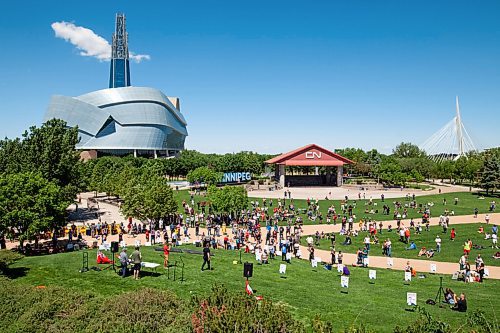 Daniel Crump / Winnipeg Free Press. Over a hundred people attend an anti-restrictions rally at the Forks on Saturday afternoon. June 12, 2021.