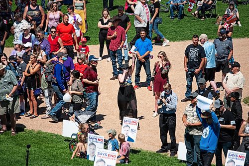 Daniel Crump / Winnipeg Free Press. A handful of counter protestors make noise and throw glitter at people at an anti-restrictions rally at the Forks on Saturday afternoon. June 12, 2021.