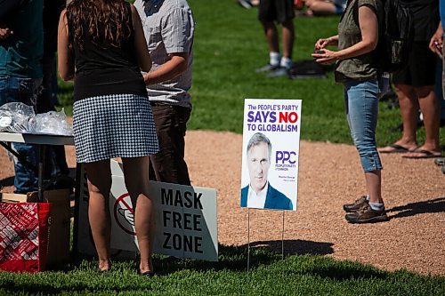 Daniel Crump / Winnipeg Free Press. Signs for Maxime Bernier are a prominent feature during an anti-restrictions rally at the Forks on Saturday afternoon. June 12, 2021.