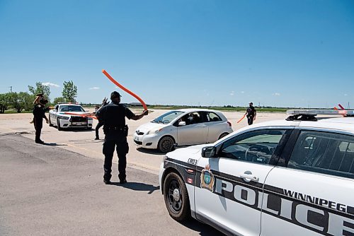 ALEX LUPUL / WINNIPEG FREE PRESS  

The Winnipeg Police Service welcomes  attendees to the Winnipeg International Children's Festival at the Red River Exhibition Park on Sunday, June 13, 2021. Due to ongoing restrictions, the format has shifted to a drive-in format.