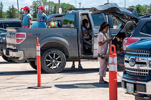 ALEX LUPUL / WINNIPEG FREE PRESS  

Attendees enjoy the Winnipeg International Children's Festival from the comfort of their vehicles at the Red River Exhibition Park on Sunday, June 13, 2021. Due to ongoing restrictions, the format has shifted to a drive-in format.