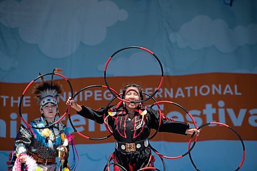ALEX LUPUL / WINNIPEG FREE PRESS  

The Summer Bear Dance Troupe performs a hoop dance at the Winnipeg International Children's Festival at the Red River Exhibition Park on Sunday, June 13, 2021. Due to ongoing restrictions, the format has shifted to a drive-in format.