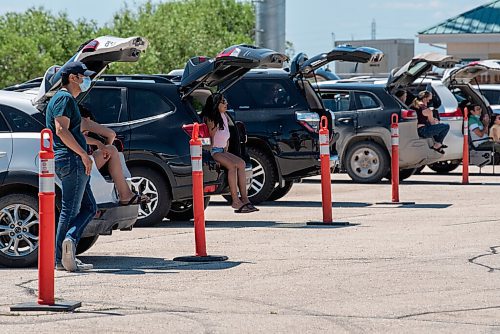 ALEX LUPUL / WINNIPEG FREE PRESS  

Attendees enjoy the Winnipeg International Children's Festival from the comfort of their vehicles at the Red River Exhibition Park on Sunday, June 13, 2021. Due to ongoing restrictions, the format has shifted to a drive-in format.