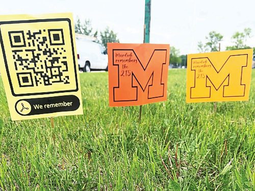 Canstar Community News A QR code has been printed on the book of each of the orange Ms so passersby can scan it and share their thoughts on a website linked to the code.