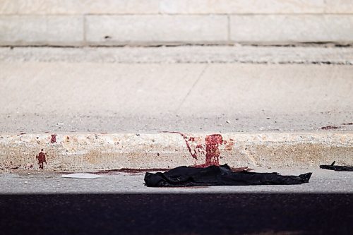 MIKAELA MACKENZIE / WINNIPEG FREE PRESS

Police investigate the scene of a shooting at Young and Westminster in Winnipeg on Monday, June 14, 2021. For Malak story.
Winnipeg Free Press 2021.