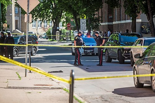 MIKAELA MACKENZIE / WINNIPEG FREE PRESS

Police investigate the scene of a shooting at Young and Westminster in Winnipeg on Monday, June 14, 2021. For Malak story.
Winnipeg Free Press 2021.