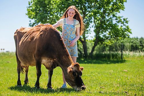 MIKAELA MACKENZIE / WINNIPEG FREE PRESS

Jessica Walker, who created and runs Little Red Barn Micro Sanctuary, poses for a portrait with 12-year-old jersey cow Serenity in Charleswood on Monday, June 14, 2021. Jessica rescues a variety of animals, including pigs, chickens, goats, sheep, cows and horses. She also gives tours to people of all ages in an effort to educate them about -- and give them a better appreciation for -- these animals. For Aaron Epp story.
Winnipeg Free Press 2021.
