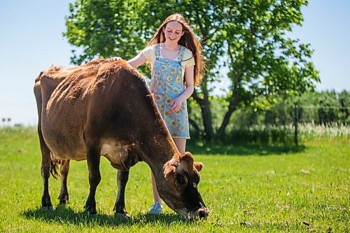 MIKAELA MACKENZIE / WINNIPEG FREE PRESS
Jessica Walker, who created and runs Little Red Barn Micro Sanctuary, poses for a portrait with 12-year-old jersey cow Serenity in Charleswood on Monday, June 14, 2021. Jessica rescues a variety of animals, including pigs, chickens, goats, sheep, cows and horses. She also gives tours to people of all ages in an effort to educate them about -- and give them a better appreciation for -- these animals. For Aaron Epp story.
Winnipeg Free Press 2021.