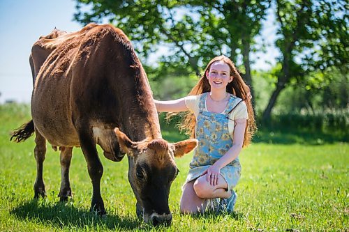 MIKAELA MACKENZIE / WINNIPEG FREE PRESS

Jessica Walker, who created and runs Little Red Barn Micro Sanctuary, poses for a portrait with 12-year-old jersey cow Serenity in Charleswood on Monday, June 14, 2021. Jessica rescues a variety of animals, including pigs, chickens, goats, sheep, cows and horses. She also gives tours to people of all ages in an effort to educate them about -- and give them a better appreciation for -- these animals. For Aaron Epp story.
Winnipeg Free Press 2021.