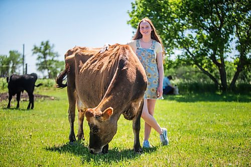 MIKAELA MACKENZIE / WINNIPEG FREE PRESS

Jessica Walker, who created and runs Little Red Barn Micro Sanctuary, poses for a portrait with 12-year-old jersey cow Serenity in Charleswood on Monday, June 14, 2021. Jessica rescues a variety of animals, including pigs, chickens, goats, sheep, cows and horses. She also gives tours to people of all ages in an effort to educate them about -- and give them a better appreciation for -- these animals. For Aaron Epp story.
Winnipeg Free Press 2021.