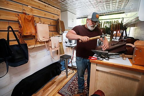 JOHN WOODS / WINNIPEG FREE PRESS
Chuck Allen, owner of Earth & Hide, a home-based pottery and leather works business, is photographed as he works on his product Monday, June 14, 2021. 

Reporter: Sanderson